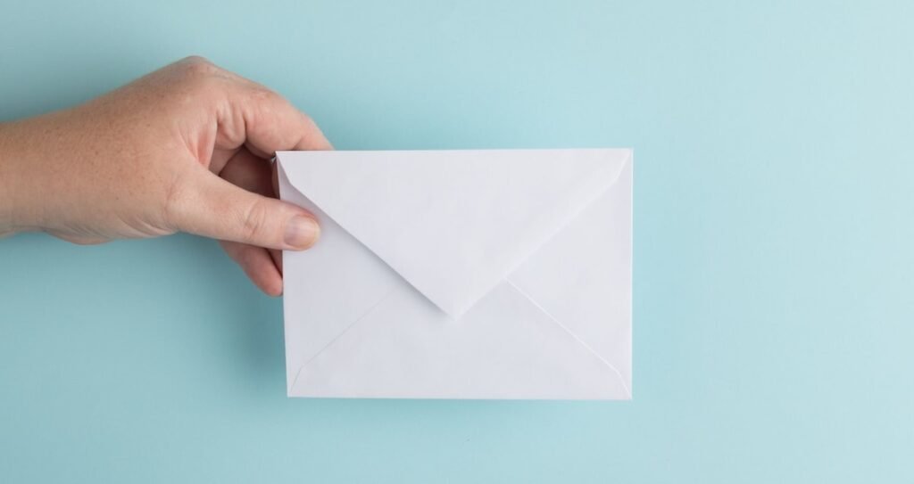 person showing white envelope